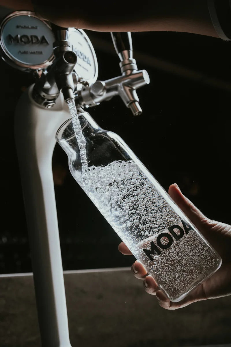 Sparkling carafe being filled